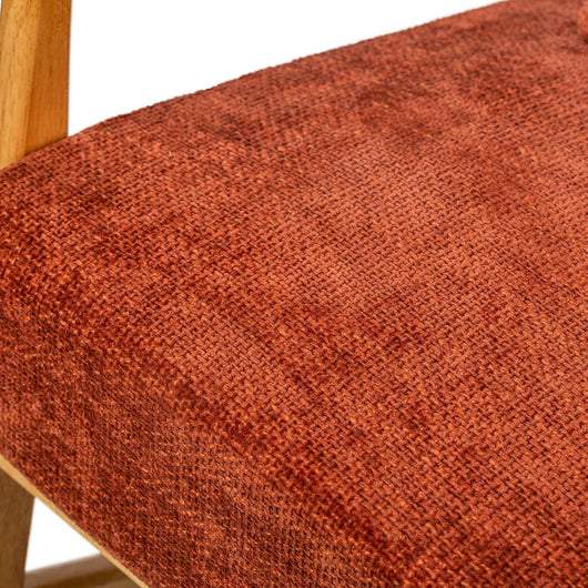 Sedia a dondolo in legno massiccio e tessuto in terracotta